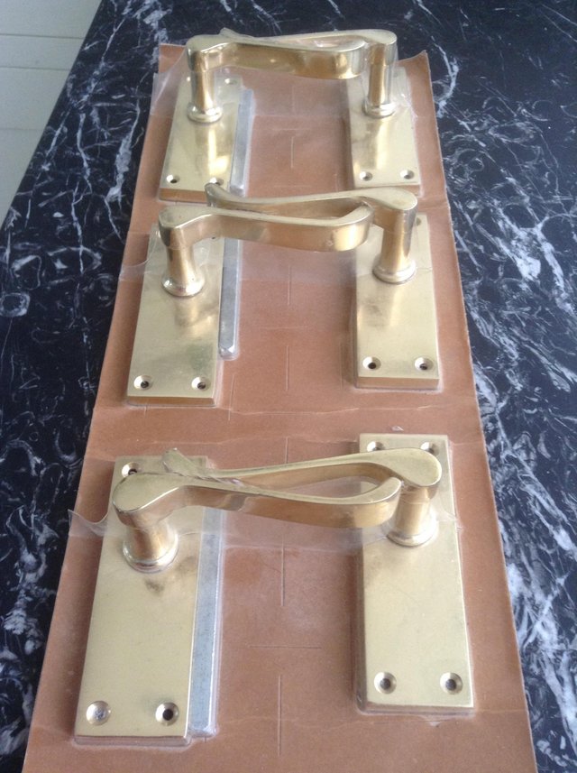 Preview of the first image of DOOR HANDLES Vintage brass interior scroll lever 3 pairs New.