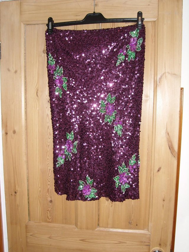 Preview of the first image of Vintage Warehouse Sparkle Skirt – size 12.