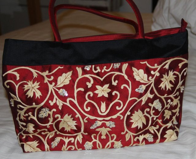 Preview of the first image of Red Silk Handbag With Embroidery and Sequins.