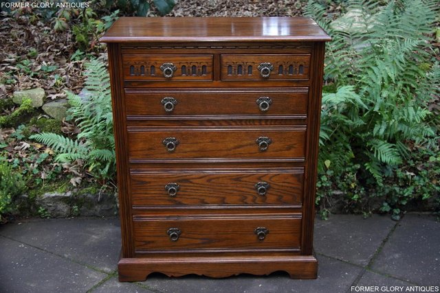 Preview of the first image of AN OLD CHARM JAYCEE LIGHT OAK TALL CHEST OF DRAWERS STAND.
