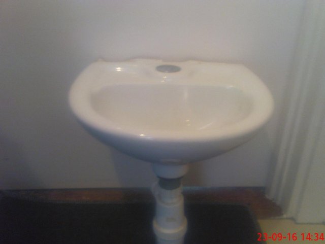 Preview of the first image of WHITEPORCELAINSMALL CORNER HAND WASH BASIN.