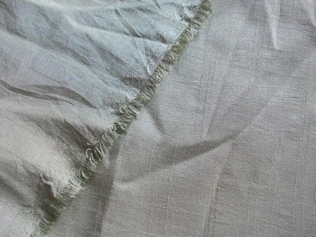 Preview of the first image of PALE OLIVE GREEN SHIMMERY SLUB WEAVE LIGHTWEIGHT FABRIC 117x.