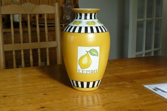 Preview of the first image of Lemon motif 12" tall vase with white and black stripes..