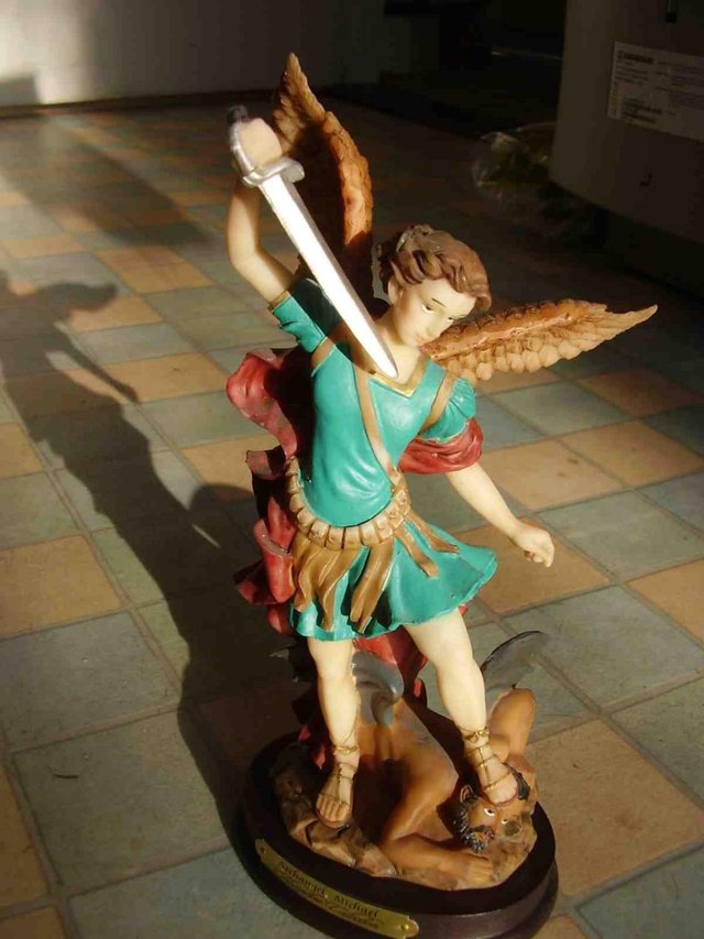 Preview of the first image of Archangel Michael statue - resin on a wooden base.