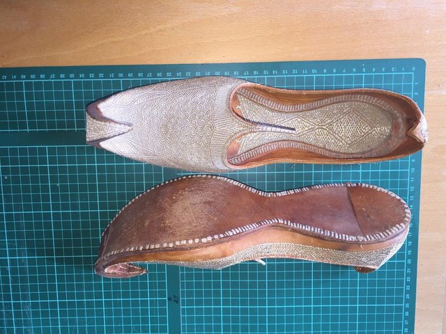 Preview of the first image of Aladdin slippers,silver thread on leather..