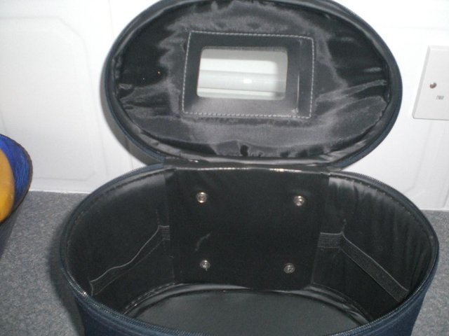 Preview of the first image of Navy oval shape new vanity case - Brand New.