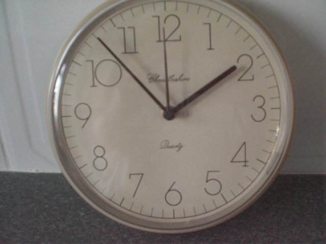 Preview of the first image of Cheadleshire Quartz Kitchen Clock - Beige and Brown.