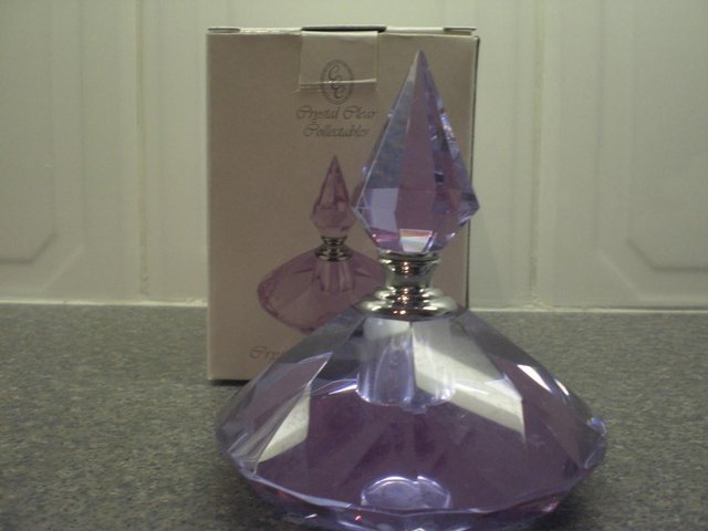 Preview of the first image of Crystal Clear collectables perfume bottle Mauve/lilac colour.
