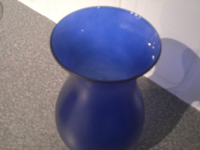 Preview of the first image of Pretty Blue shaped glass vase.