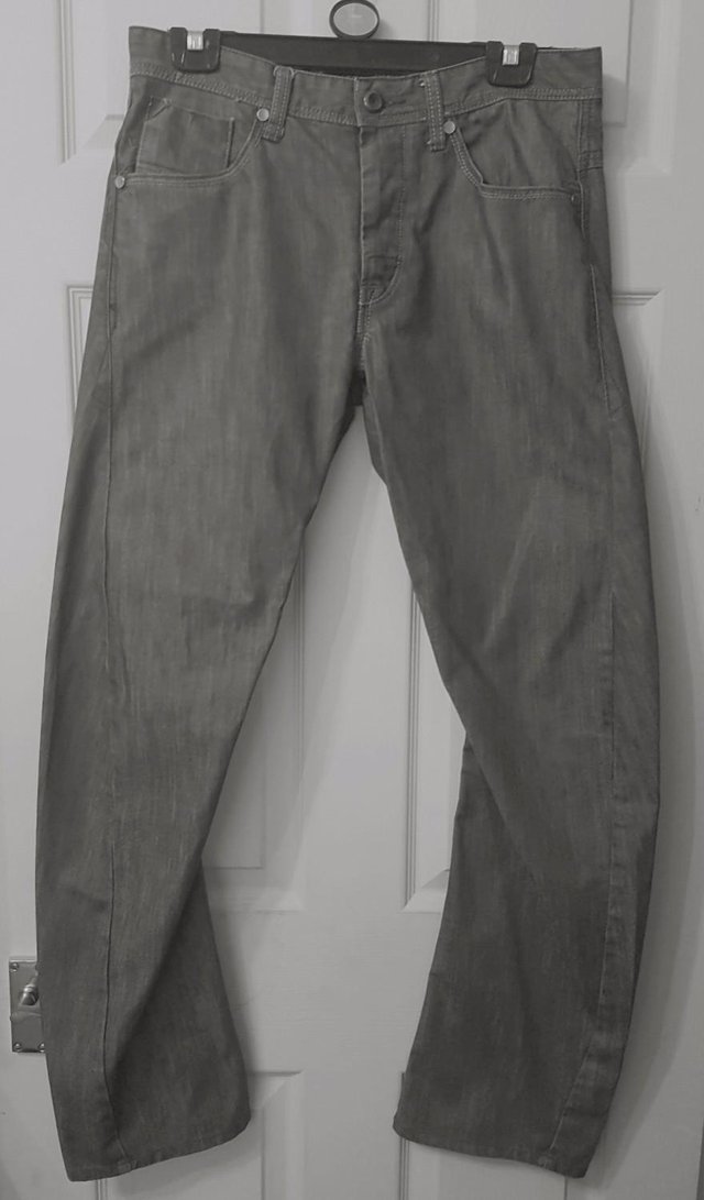 Preview of the first image of Men's Grey Twisted/Arc Leg Jeans By next - Sz 30R.