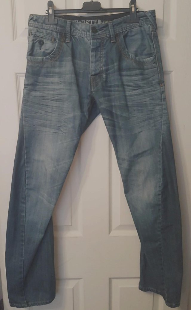 Preview of the first image of Men's Premium Denim Twisted/Arc Leg Jeans - Sz 30" W/31" L.