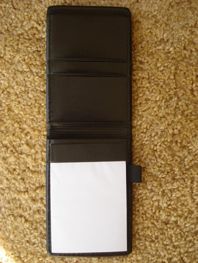 Preview of the first image of NEW  BLACK LEATHER LOOK NOTEPAD HOLDER WITH PEN HOLDER.