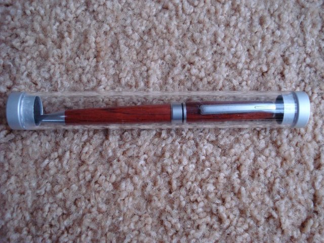 Preview of the first image of NEW QUALITY WOODEN PEN IN PRESENTATION GIFT TUBE.