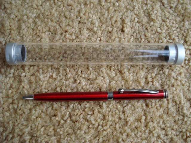 Preview of the first image of NEW QUALITY RED METAL PEN IN PRESENTATION GIFT TUBE.