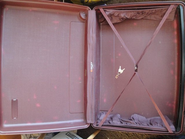 Preview of the first image of Delsey Hard Shell Suitcase. Used with keys. L1298.