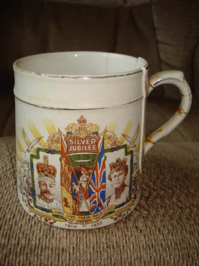 Preview of the first image of ANTIQUE KING GEORGE V QUEEN MARY SILVER JUBILEE 1910-35 MUG.