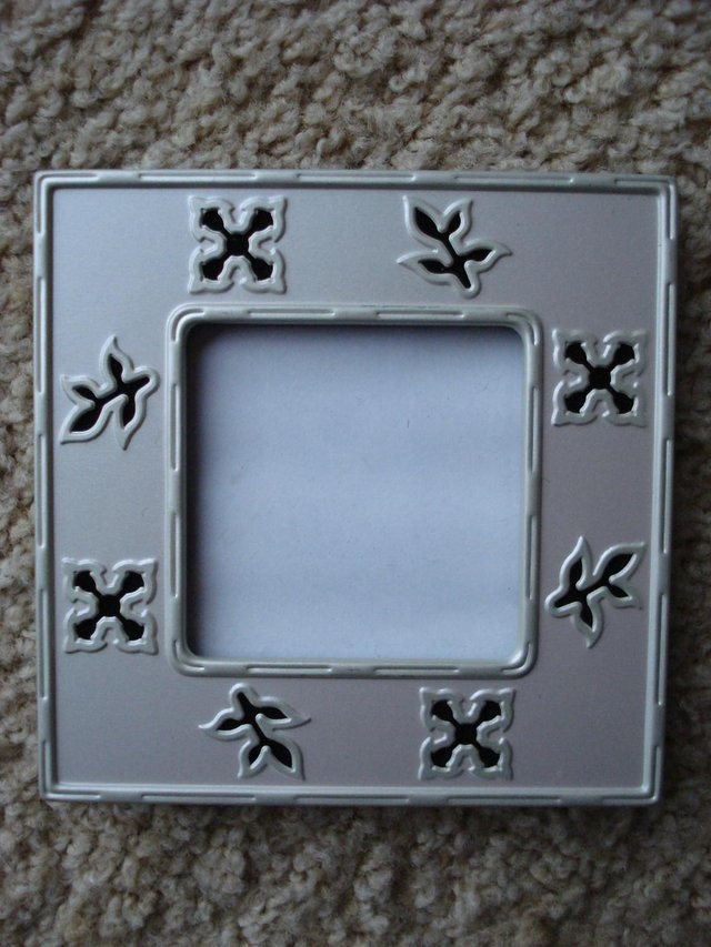 Preview of the first image of SILVER/SATIN COLOURED PICTURE/PHOTO FRAME FOR 2¼”x2¼” PHOTO.