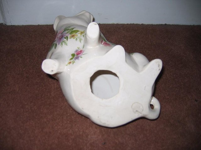 Image 3 of Vintage sitting Pottery pig floral pattern pretty but has cr