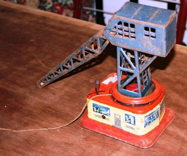 Preview of the first image of VINTAGE GERMAN CRANE WIND UP TIN TOY LITHOGRAPHY .