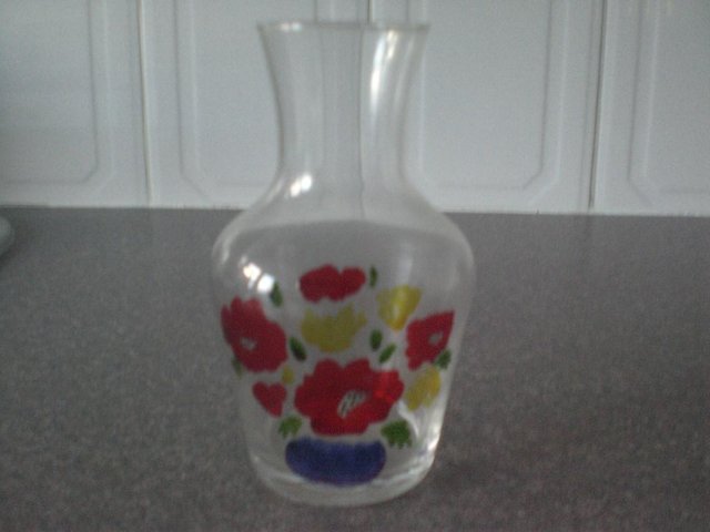 Preview of the first image of Clear Glass vase with Hand Painted Flowers on front.