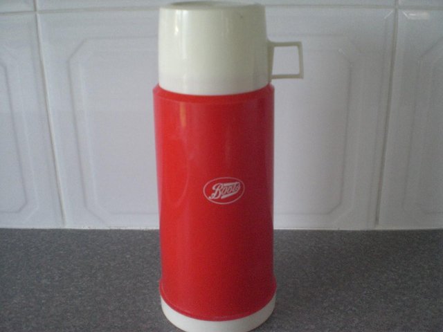 Preview of the first image of Large Red Thermos Flask from Boots, with two white cups.
