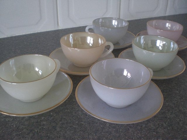 Preview of the first image of 6 Opal glass with gold effect on edge of cups and saucers.