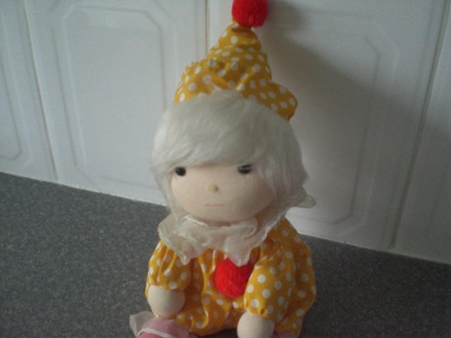 Preview of the first image of Attractive Musical Sitting Clown Doll (Brand new).