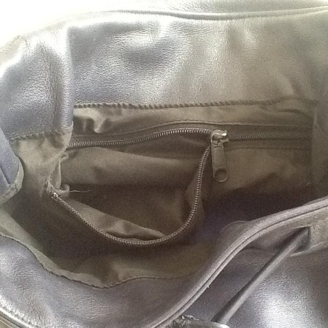 Preview of the first image of Leather lined duffel bag with useful front pocket.