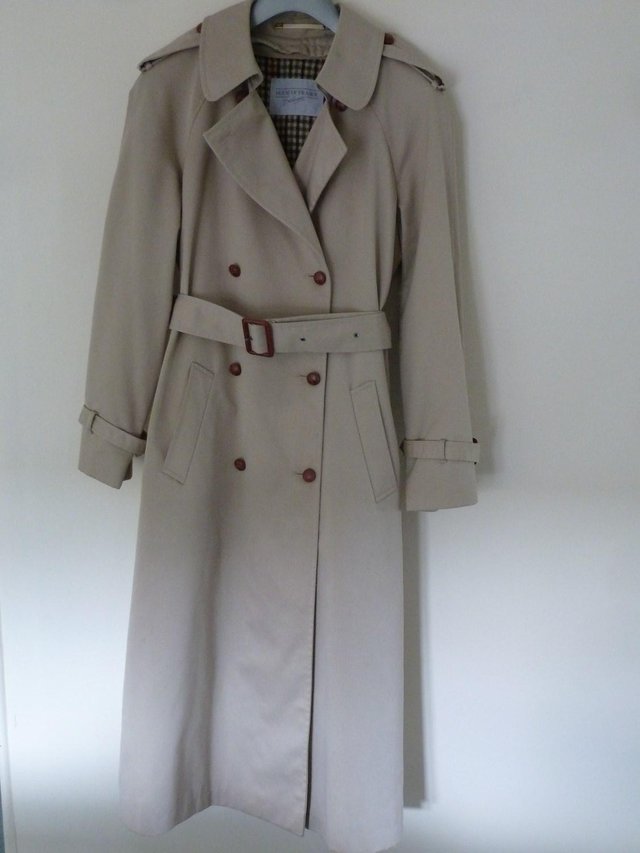 Preview of the first image of Ladies full length cream House of Fraser raincoat.