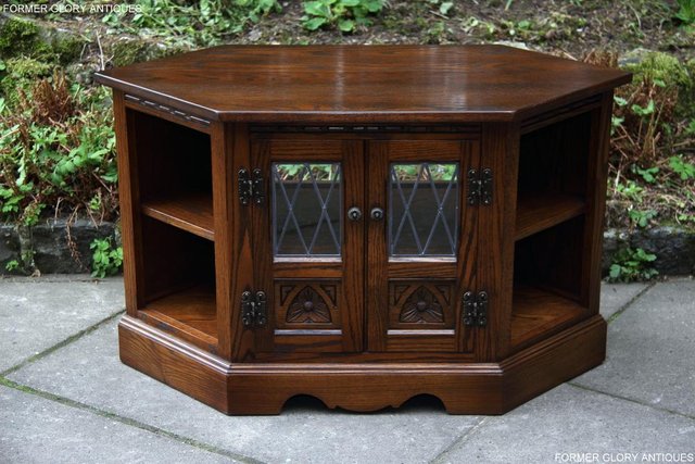 Preview of the first image of AN OLD CHARM LIGHT OAK CORNER TV DVD CD CABINET STAND TABLE.