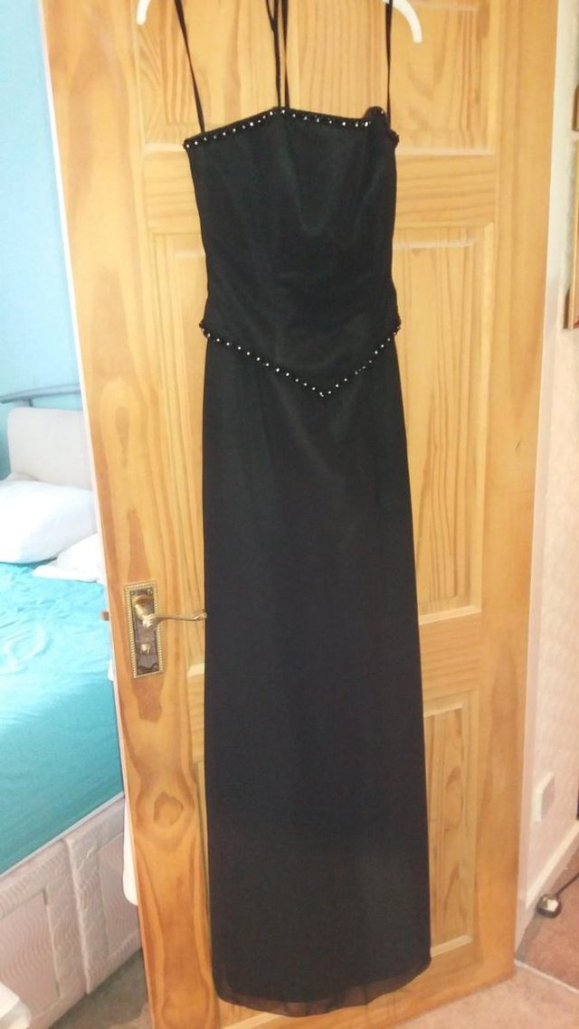 Preview of the first image of Brand new long black evening dress.