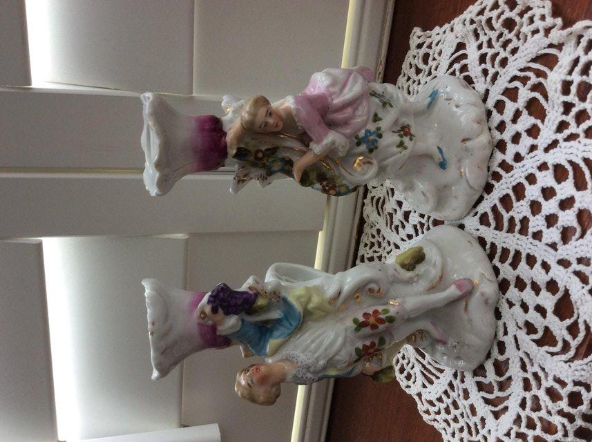 Preview of the first image of Pair of antique porceline candle holders.