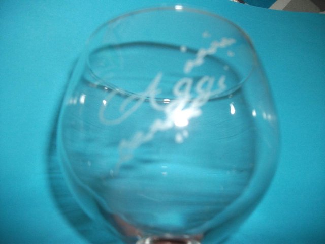 Preview of the first image of AGG'S ENGRAVED WINE/BRANDY GLASS.