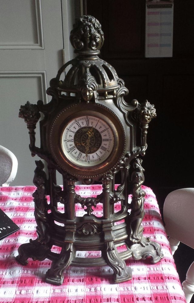 Preview of the first image of brass mechanical clock.
