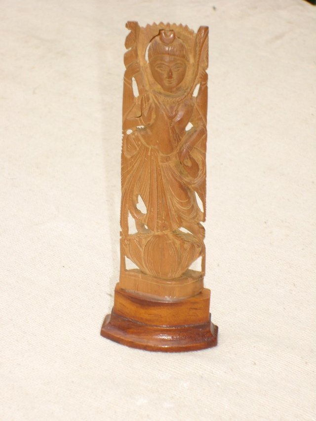 Preview of the first image of Carved Wood Statue of Lakshmi - 15cm.
