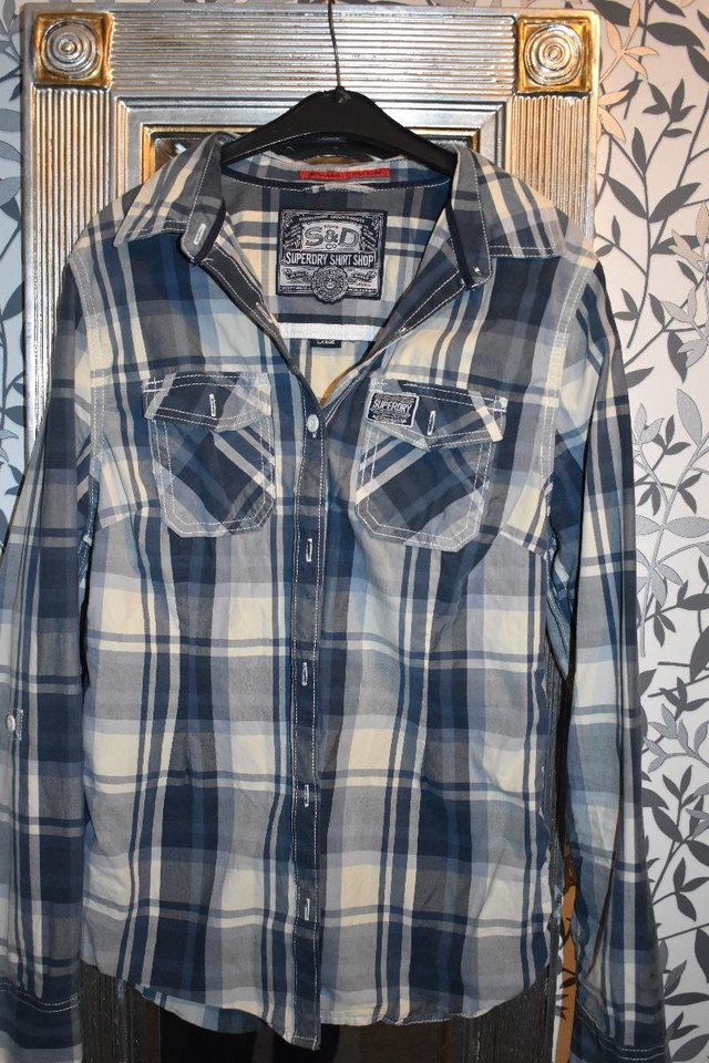 Preview of the first image of Ladies blue check Super dry shirt.