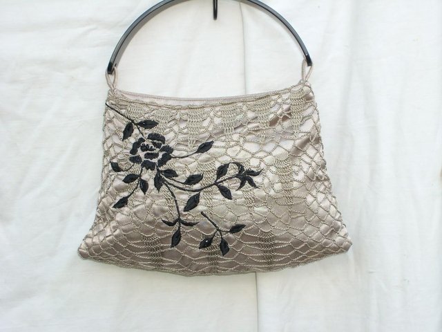 Preview of the first image of Cute Accessorize Beige Satin Fabric Handbag.