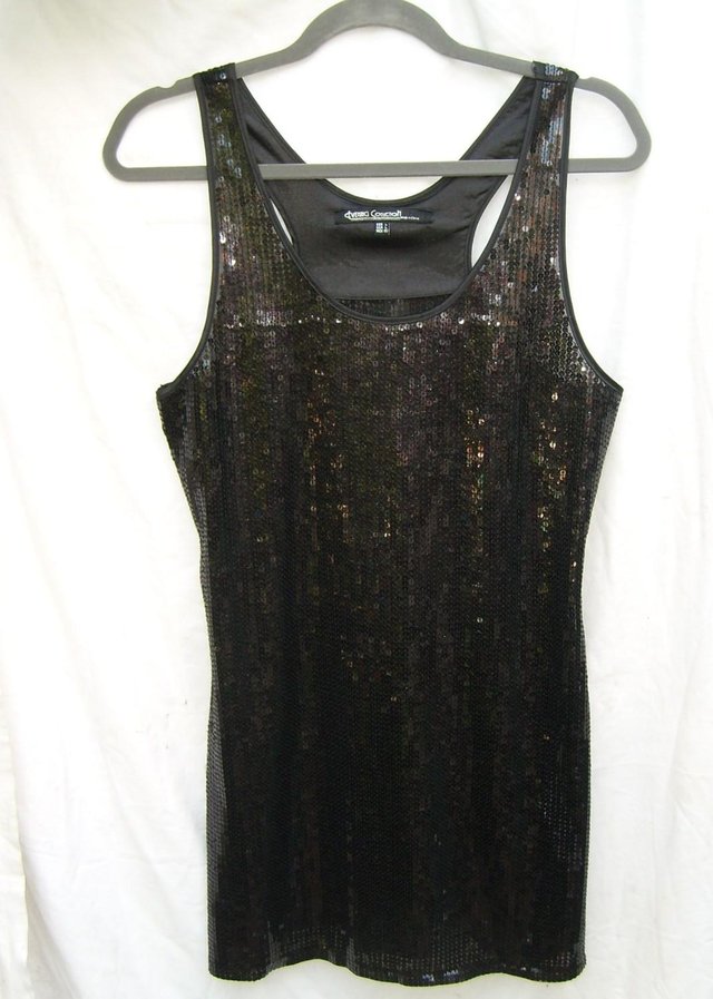 Preview of the first image of EVENING COLLECTION Black Sequin Mini Dress - Size 10/12.