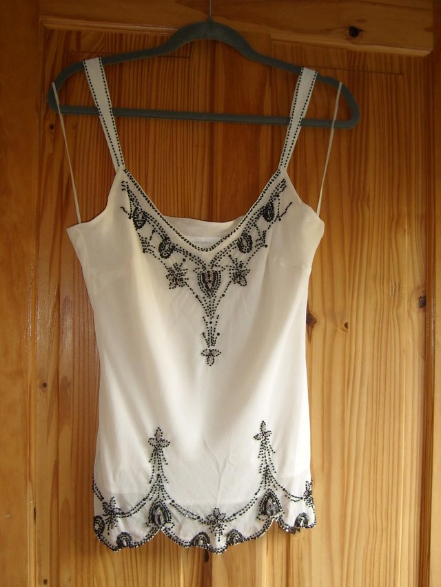 Preview of the first image of Principles Cream Silk Top With Black Beading - Size 14.