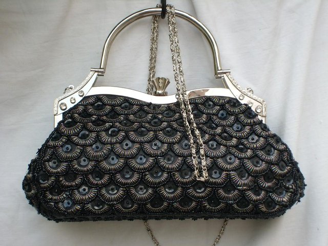 Preview of the first image of Black Snap Top Sequin Handbag.