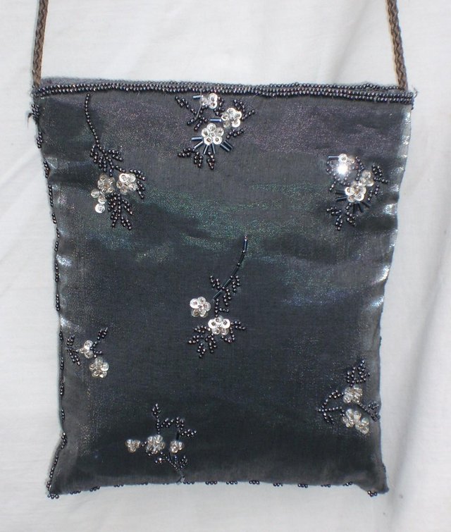 Preview of the first image of Silver/Grey Cross Body Satin Handbag.
