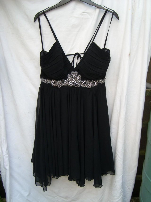 Preview of the first image of RARE LONDON Black Chiffon Mini Dress - Size 12.