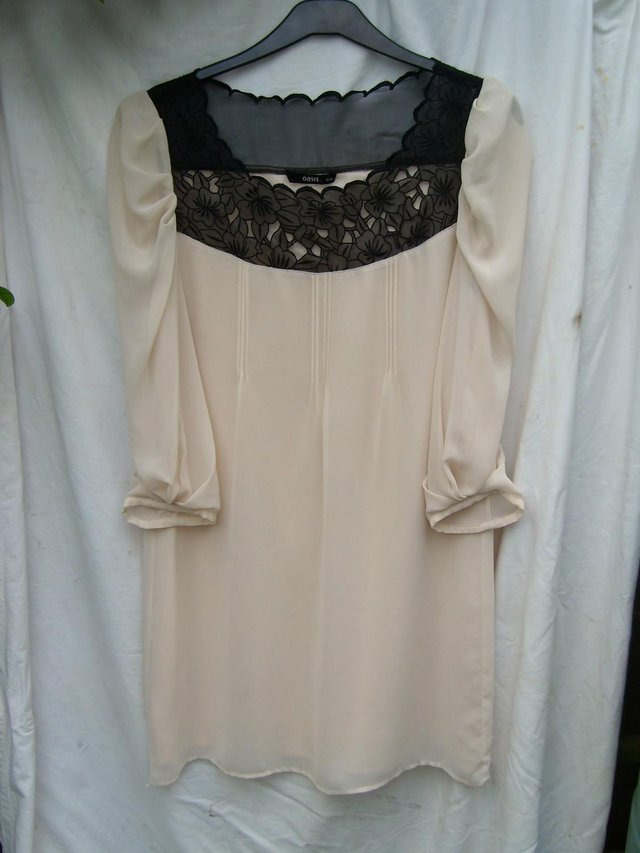 Preview of the first image of OASIS Cream Shift Dress With Black Detail - Size 12.