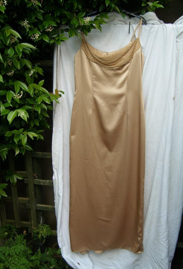Preview of the first image of OCCASSIONS Gold Satin Evening Dress - Size 18.