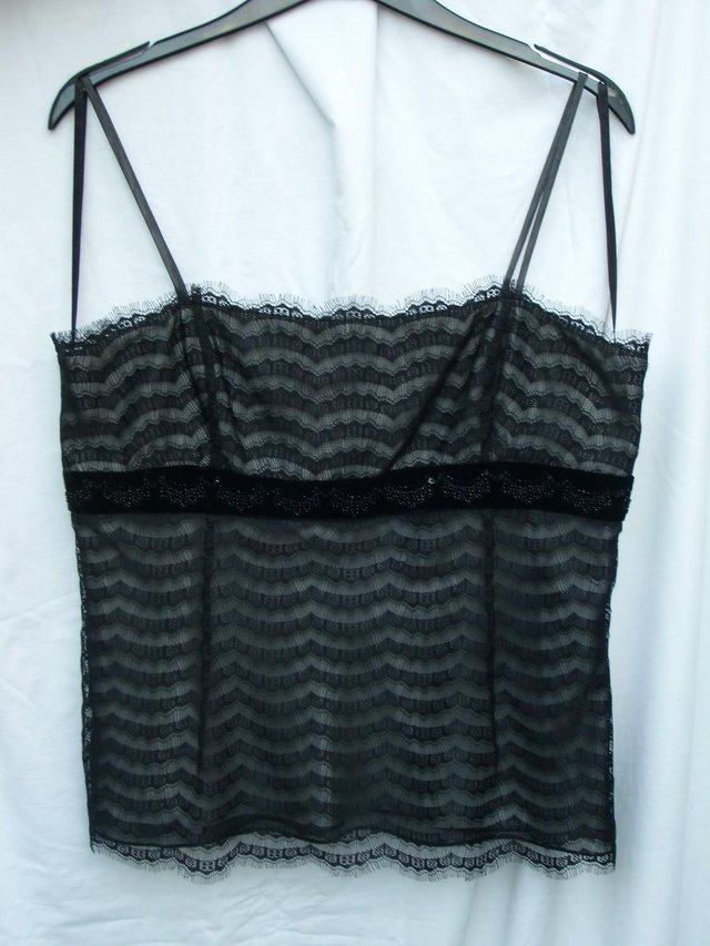 Preview of the first image of Ann Taylor Petite black lace top with velvet and bead/sequin.