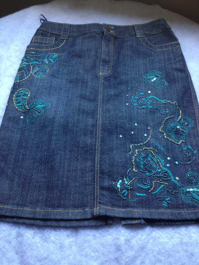 Preview of the first image of Betty Barclay demin skirt with floral applique.