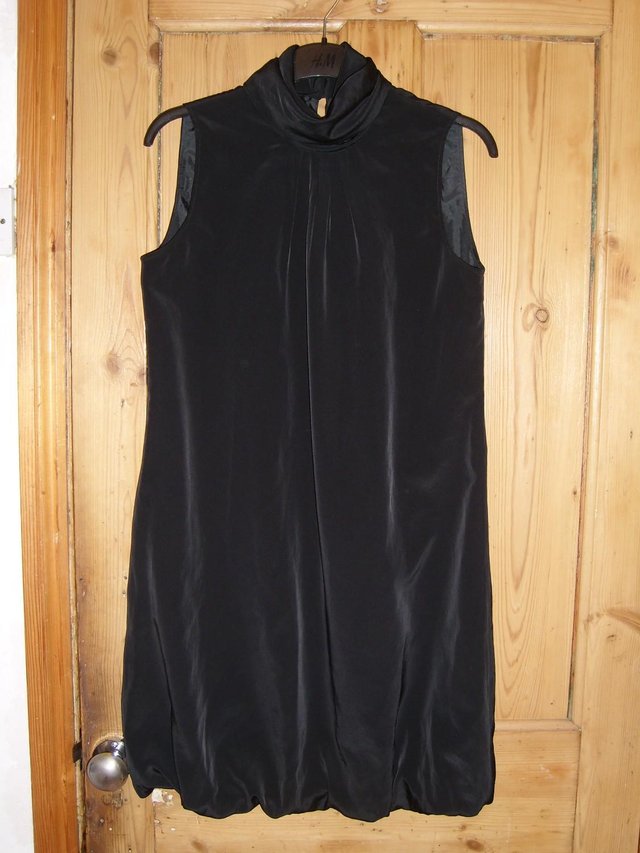 Preview of the first image of TFL Black High Neck Sleeveless Mini Dress – Size 10.