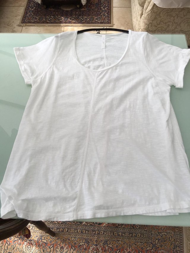 Preview of the first image of Ladies short sleeved White 22/24 summer top..