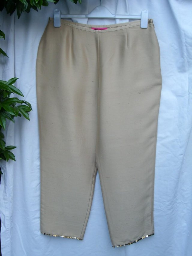 Preview of the first image of MONSOON Gold Silk Trousers – Size 14.