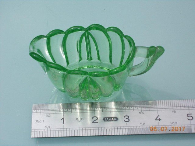 Preview of the first image of Vintage Green Glass Individual Cream Jug.